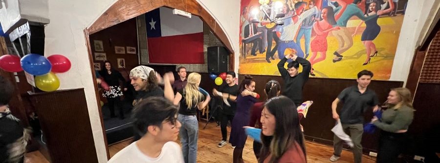 7 of 9, Students dancing in front of mural