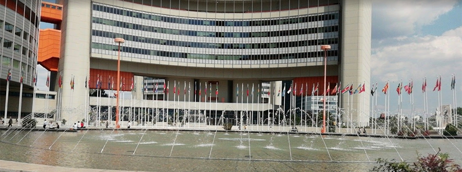 1 of 1, Vienna UN Building with fountain and flags
