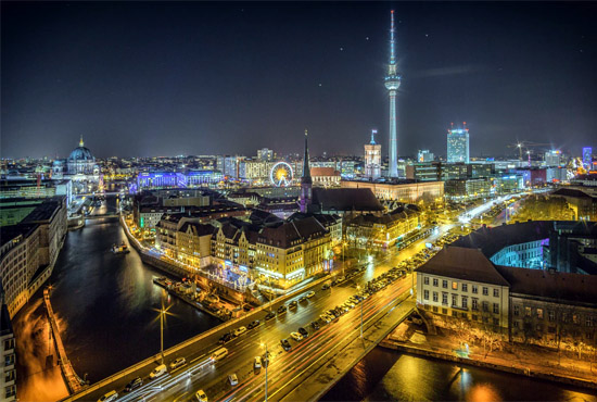 Berlin, Germany - skyline and bridge lit up at night / photo by Stefan Widua, unsplash.com/@stewi